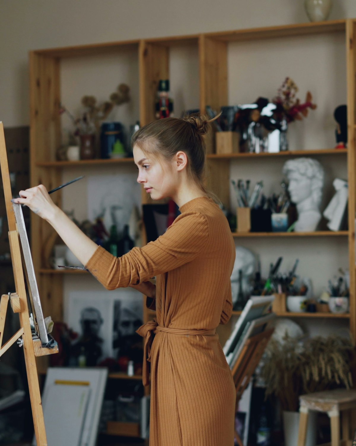 An illustrator at work in their studio